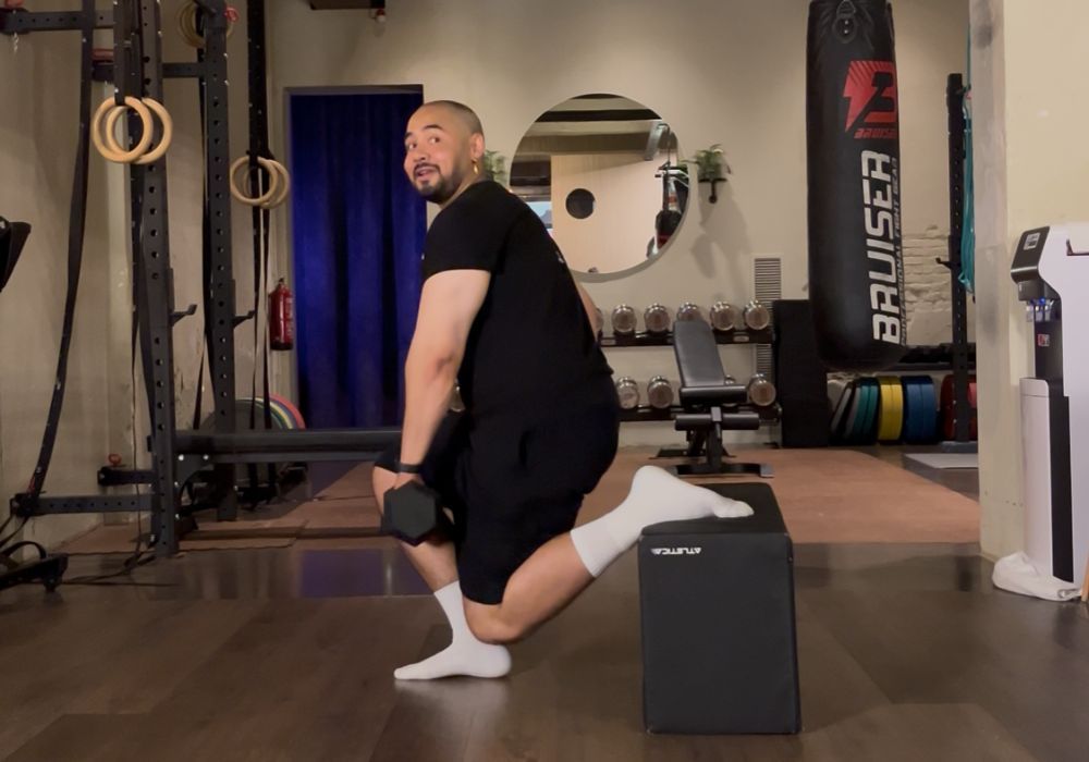 Man doing bulgarian split squat