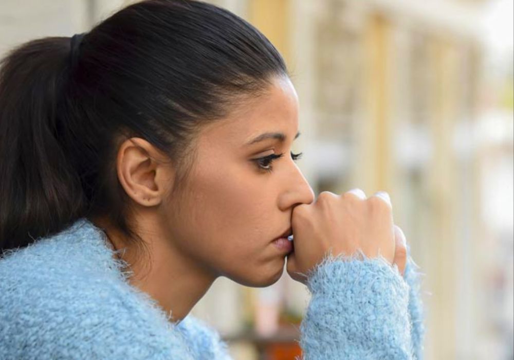 woman talking negatively to herself